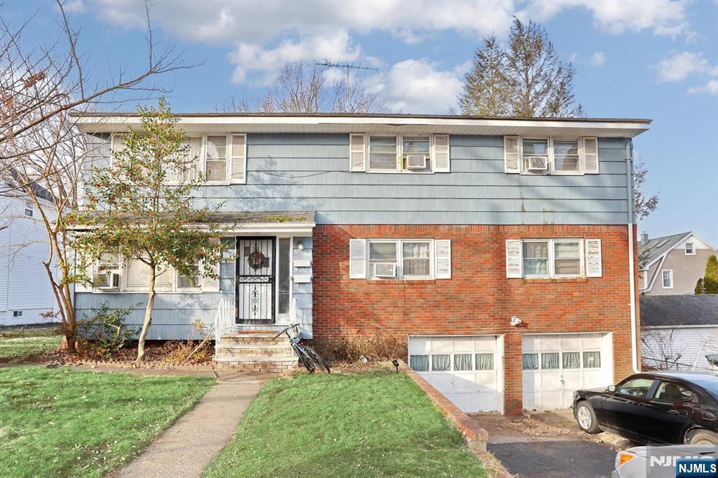 This home features over 2,500 living space with 2 units each featuring 3 bedrooms, eat in kitchen, living room and dining room. The downstairs unit has a sliding door to a deck. 2 car garage and a basement with separate utilities and washer and dryer. Huge backyard. The potential to create a beautiful home is waiting. Needs work! As is condition.. This home is perfect for an investor , flipper or someone that wants help with the mortgage payment.