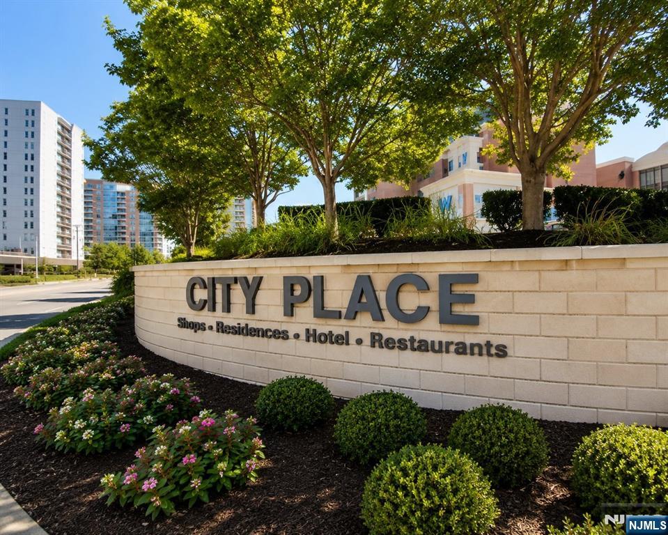 Experience luxury living in this stunning top-floor penthouse at Peninsula at City Place. Offering approximately 1,566 square feet of bright and spacious living space, this exceptional home features soaring 10-foot ceilings, oversized windows, and an elegant gallery-style entry foyer. The gourmet kitchen is beautifully appointed with black granite countertops, cherry wood cabinetry, and stainless steel appliances. Residents enjoy the convenience of City Place's shops, restaurants, and cafes right outside their door, along with neighborhood shuttle service to the Port Imperial Ferry Terminal. Easy access to NYC with NJ Transit bus service directly in front of the building. Includes two underground parking spaces (not assigned). A rare opportunity to enjoy comfort, convenience, and an unbeatable location.