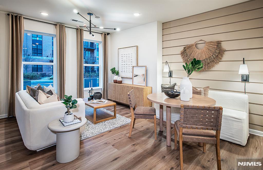 Summer Sales Event - limited opportunities remaining! Discover a vibrant blend of comfort, convenience, and connection at Bridgeview - a stunning new construction townhome community in commuter-friendly Kearny, NJ. Perfectly positioned for effortless travel, Bridgeview offers quick access to major highways, the PATH train to NYC, and Newark Liberty Airport - making it an ideal home base for busy professionals and frequent travelers alike. This beautifully designed Bowery townhome features 2 spacious bedrooms, 2 full bathrooms, and is thoughtfully set away from the main road, offering a peaceful retreat with added privacy. Inside, you'll find open-concept living areas, sleek modern finishes, and low-maintenance design - creating a space that's both stylish and functional. Step outside your door and enjoy resort-style amenities, including a sparkling pool, fitness center, elegant club room, co-working lounges, outdoor grilling areas, dog runs, and a shuttle to the PATH station. Plus, you're just a short stroll from everyday essentials and local favorites like Starbucks, LA Fitness, ShopRite, Target, BJs, and a variety of dining and entertainment options. Whether you're seeking elevated living, unbeatable convenience, or the perfect commuter location - the townhomes at Bridgeview check every box.