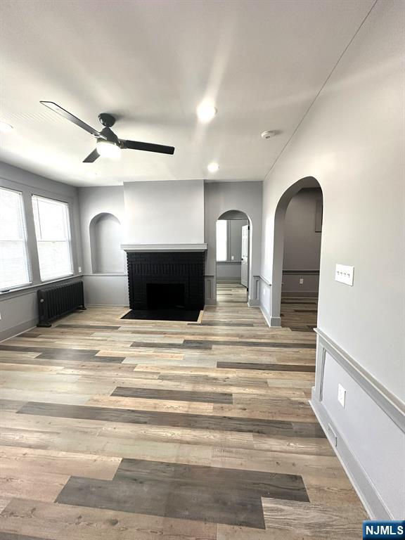 This beautifully renovated eight-room apartment is on the second floor of a multi-family home in Newark. It features three bedrooms with closets, office, den, living room with a large brick fireplace and built-in shelving, dining room, kitchen, laundry closet, a lovely full bathroom, and powder room. The apartment boasts 12-foot ceilings throughout. Conveniently situated close to Beth Israel Hospital, Newark International Airport, Newark Penn Station, NJ Transit to NYC, and the Garden State Parkway. Owner Occupied.