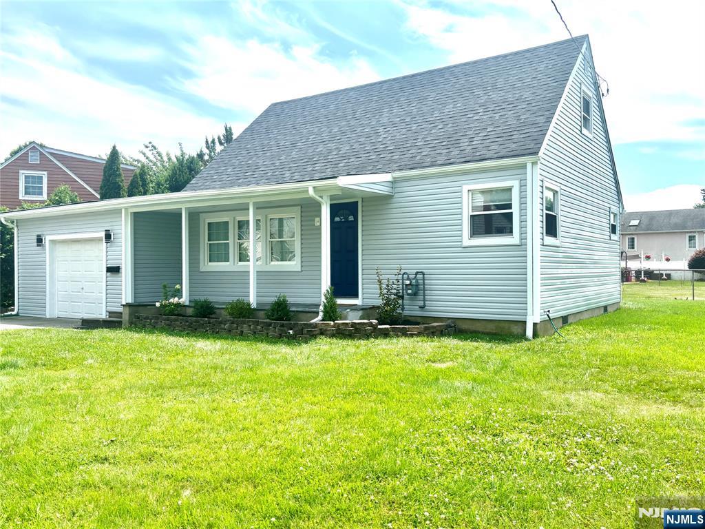 Welcome beautiful Cape Cod-style home features a new roof, new siding, and new flooring throughout. Freshly painted and move-in ready, it offers a bright and inviting living space. Step into a living room that flows into an eat-in kitchen with easy access to the backyardâ€”perfect for entertaining or relaxing outdoors. The main level includes a full bathroom and a convenient first-floor bedroom, and utility room that can easily be converted to a bathroom, bedroom or office. Upstairs, you'll find two additional bedrooms offering comfort and privacy. The oversized garage provides ample storage or workshop space. Enjoy the sunny bright yardâ€”great for gardening or outdoor activities. Best of all, this property is not in a flood zone and features low taxes! Don't miss this charming, turnkey home in a great location!