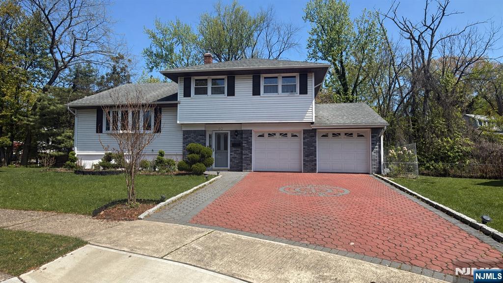 Located on a quiet cul-de-sac, this Sugar Maple split-level home features 3 bedrooms and 2 full baths. Ground level offers an entry foyer, family room, and full bath. Partially finished basement provides additional space. First floor features a large living room, dining area, and modern eat-in kitchen with newer granite countertops and sliding doors leading to a large deck. Second floor offers 3 bedrooms and a full bath. Home features central air, baseboard heat, and a newer furnace installed in 2025. Additional features include a paved patio, paved driveway, and great backyard space. Conveniently located near schools, shopping, parks, and transportation.