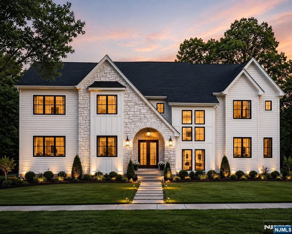Crafted with exceptional attention to detail & set on a picturesque .57-acre lot w/ scenic views in Livingston's desirable Riker Hill section, this extraordinary NEW CONSTRUCTION estate offers 6 beds, 6.5 baths, approximately 6,000 sq ft of designed living space, & 3 beautifully finished levels of luxury.A dramatic 2-story foyer framed by Andersen windows welcomes abundant natural light, while soaring ceilings, wide-plank hardwood floors, glass-railed staircases & custom millwork create an elegant backdrop throughout. The chef's kitchen showcases custom white & oak cabinetry, quartz countertops w/ a matching backsplash, Thermador appliances, an oversized center island, walk-in pantry & a spacious breakfast area w/ access to the patio.The family room boasts a soaring 20-ft ceiling, sleek fireplace, built-in speakers & seamless indoor-outdoor flow overlooking the backyard.The main level also features a private guest suite, mudroom & attached 3-car garage.Upstairs, the luxurious primary suite offers tray ceilings, dual WIC's & a spa-inspired bath, while every add'l 2nd floor bedroom enjoys its own private en-suite bath.The finished lower level is designed for entertaining w/ a spacious rec room featuring a custom wet bar, media room, fitness room & flexible living space. Add'l highlights include 10-ft ceilings on the 1st floor, 9-ft ceilings on the 2nd floor & lower level, heated floors in the primary bath & powder room, smart home technology & a 10-Year Builder Warranty.