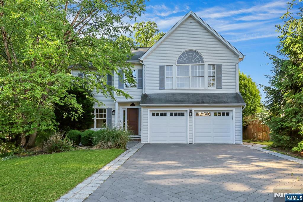 Welcome to this stunning Colonial-style home offering the perfect blend of elegance, comfort, and modern living. Featuring 4 spacious bedrooms and 3 full bathrooms, this beautifully maintained residence boasts an open-concept floor plan filled with natural sunlight throughout. The inviting family room showcases a cozy gas fireplace and flows seamlessly into the main living and entertaining areas. The luxurious primary suite features a soaring cathedral ceiling, a private full bath, and two walk-in closets. The finished basement provides exceptional additional living space, complete with a wet bar, 5th bedroom, and full bathâ€”ideal for guests, extended family, recreation, or a home office. Bright, spacious, and thoughtfully designed, this exceptional home offers the perfect setting for both everyday living and entertaining. Conveniently located in desirable Montvale, close to shopping, dining, parks, and transportation.
