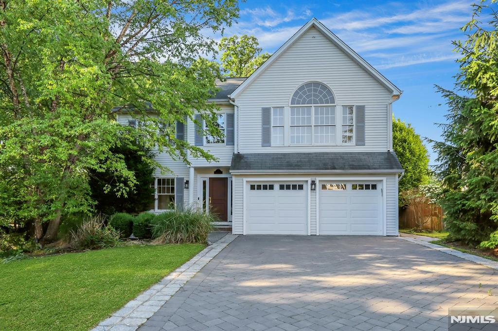 Welcome to this stunning Colonial-style home offering the perfect blend of elegance, comfort, and modern living. Featuring 4 spacious bedrooms and 3 full bathrooms, this beautifully maintained residence boasts an open-concept floor plan filled with natural sunlight throughout. The inviting family room showcases a cozy gas fireplace and flows seamlessly into the main living and entertaining areas. The luxurious primary suite features a soaring cathedral ceiling, a private full bath, and two walk-in closets. The finished basement provides exceptional additional living space, complete with a wet bar, 5th bedroom, and full bathâ€”ideal for guests, extended family, recreation, or a home office. Bright, spacious, and thoughtfully designed, this exceptional home offers the perfect setting for both everyday living and entertaining. Conveniently located in desirable Montvale, close to shopping, dining, parks, and transportation.