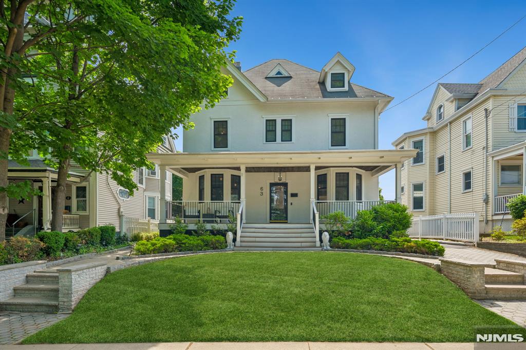 Welcome home to this beautifully renovated classic where timeless charm meets modern living. Set on a generous 50x130 lot, this impressive home offers lovely curb appeal with a welcoming front porch, classic architecture, and everything you've been waiting for in your next home. Inside, you'll find bright, spacious living and dining areas, exposed brick accents, an updated kitchen and baths, and a layout designed for both everyday living and entertaining. The main level also features a versatile office that could also serve as a bedroom, along with a full bath and first floor laundry room. The second level offers three spacious bedrooms, including a beautiful primary suite, updated bathrooms, and abundant natural light. The finished third level provides exceptional flexibility with a fourth bedroom, half bath, and bonus living space ideal as a playroom, home office, guest retreat, or potential second primary suite. The spectacular fully finished basement is a true standout, featuring a custom home theater and expansive recreation and entertaining areas. Designed for entertaining, the resort-style backyard features a large in-ground pool, expansive deck, cabana/bar area, and multiple seating and dining spaces. Ideally located near Rutherford's vibrant downtown, parks, shopping, dining, and NYC transportation, this one-of-a-kind home offers the perfect blend of classic character, modern updates, beautiful finishes, and exceptional indoor-outdoor living.