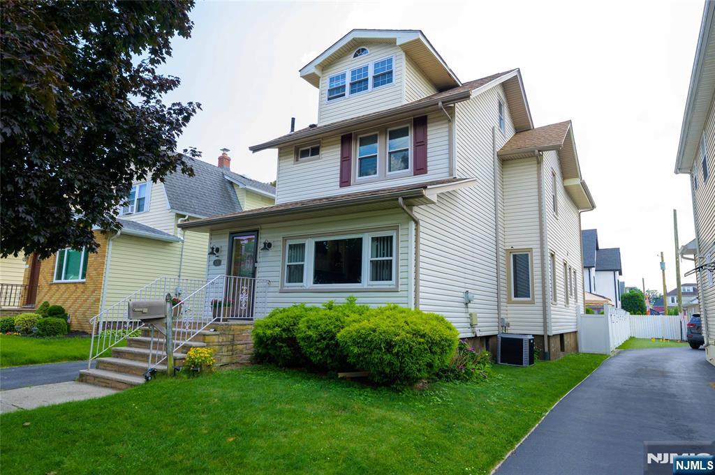 Spacious 4 bedroom, 2.5 bath colonial. SUN-FILLED 1st floor has seamless flow from entry foyer. sun-room, large living room, separate dining room, updated kitchen to the versatile back room that can be used as a den and/or office with half bath. Easily convert one of the two full baths on the second floor into an ensuite bath for a primary bedroom suite. Deck, patio and grilling area in the spacious back yard are great for entertaining. Large shed. Full finished basement with walk-out, rec room, laundry and large storage closets. Full walk-up attic has potential for office and ample storage. Central air. New roof and driveway. GREAT LOCATION. EASY access/commute to NYC. Minutes from NYC bus, Rte 3, Garden State Parkway and NJ Turnpike. Close to parks, schools, shopping and restaurants.