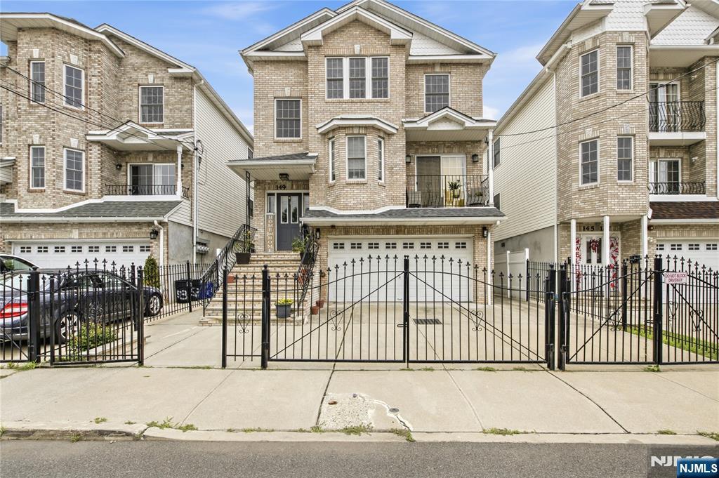 Exceptional investment or owner-occupant opportunity in Newark! This massive, turn-key 3-family property at 149 Bellair Pl. offers approximately 4,514 sq ft of living space, featuring 8 spacious bedrooms and 6 full bathrooms distributed across three distinct levels.Unit 1 (Ground Level): Features 2 bedrooms, 2 full bathrooms, and in-unit laundry facilities. Currently tenant-occupied, generating $2,000/month.Unit 2 (Second Floor): Features 3 bedrooms, 2 full bathrooms, a private front balcony, and in-unit laundry. Currently rented at $2,800/month with the lease expiring in August offering immediate upside potential or flexible occupancy options.Unit 3 (Third Floor): Owner-occupied, mirror floor plan of the 2nd floor featuring 3 bedrooms, 2 full bathrooms, and in-unit laundry. Perfect for an owner-occupant looking to live virtually mortgage-free or an investor aiming to maximize rental income.Every unit in this building enjoys dedicated in-unit laundry facilities for maximum tenant convenience. Exterior amenities include off-street parking provided by a 2-car garage and a 2-car driveway. The rear yard features a low-maintenance stone patio area, ideal for outdoor relaxation. Situated near local parks, community venues, and public transportation routes. Schedule your private tour today to explore this multi-family asset!
