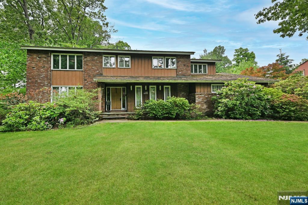 So many possibilities! Expand or Update existing home or build your new dream home on a hard-to-find, oversized .70 acre lot. Extraordinary lot & home on a beautiful street. .70 acre of level property. Existing home is a custom built 5 BR, 3.5 Bath Colonial w/2,983 sf & 2 car garage to be sold as-is. I/G pool and cabana also as-is. Full unfinished basement with bilco doors to outside. Multi zone gas heat & central air. Aluminum siding exterior & brick front. Please note, there is currently well water in use. The well is shared between several properties. Public water is in the street for possible hookup . Close to NY bus park & ride, route 17, Garden State Parkway, the New Valley Hospital, DiMaggio Park (local park), shopping & more.