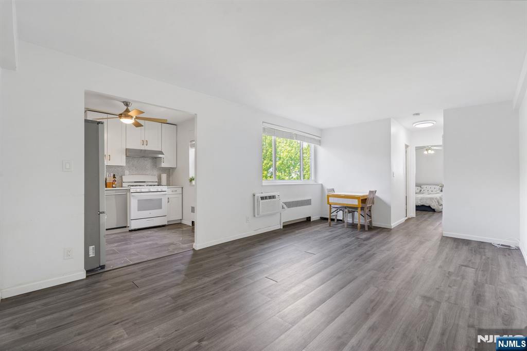Welcome to Marycrest Condominiums, this spacious 1 bed, 1 bath condo offers beautiful living with unbeatable urban convenience. Inside you'll find a bright, airy, and expansive open-concept living/dining space, perfect for quiet relaxation and effortless entertaining. Premium engineered hardwood floors run seamlessly throughout the entire layout, catching beautifaul natural light and anchoring the space with a sophisticated feel. The updated kitchen maximizes style and function with durable quartz counters, a herringbone tile backsplash, a ceiling fan, and sleek appliances including a built-in dishwasher. The generously sized bedroom serves as a quiet retreat, offering plenty of space and ample closet space. The community at Marycrest offers fantastic amenities including an included on-site parking space, elevator, a 24-hour on site super, a secure electronic entry system with security cameras, and on-site laundry. Your monthly maintenance fee covers your core utilities, including heat, hot water, and water. Express buses to NYC right across the street, while drivers will appreciate immediate access to TPK, Rt 4, and the Palisades Parkway. Just 2 blocks from the Linwood Plaza Shopping Center and an array of fantastic local dining options. When you want to unwind, the scenic overlooks of Fort Lee Historic Park, Constitution Park, and the sweeping Hudson River views are all just moments away, offering the perfect balance of suburban comfort and urban accessibility.