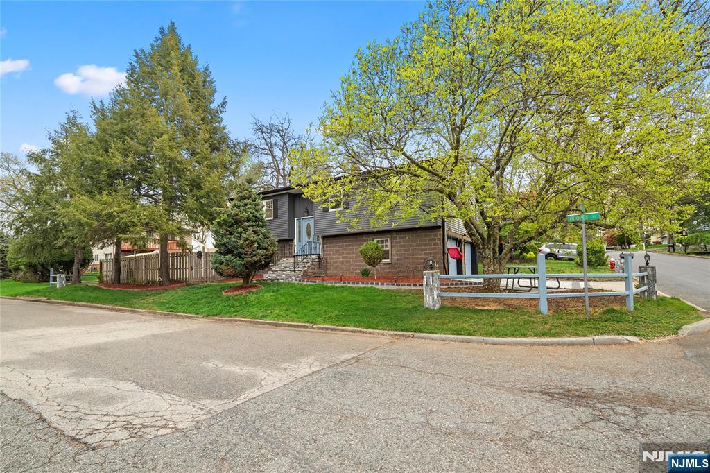 Move right into this beautifully renovated 4-bedroom, 2 full bath bi-level home in the heart of Westwood. Everything has been fully updated, offering a true move-in ready condition. This home features brand new windows, heating system, central air, and hardwood floors throughout. The modern kitchen is equipped with stainless steel appliances and quartz countertops, and both full bathrooms have been tastefully updated. The lower level includes a one-bedroom and a spacious family room, along with a 2-car garage and a fully fenced backyard with patio, perfect for outdoor enjoyment. Ideally located near NJ Transit, downtown shops and restaurants, and offering a convenient commute to Manhattan.