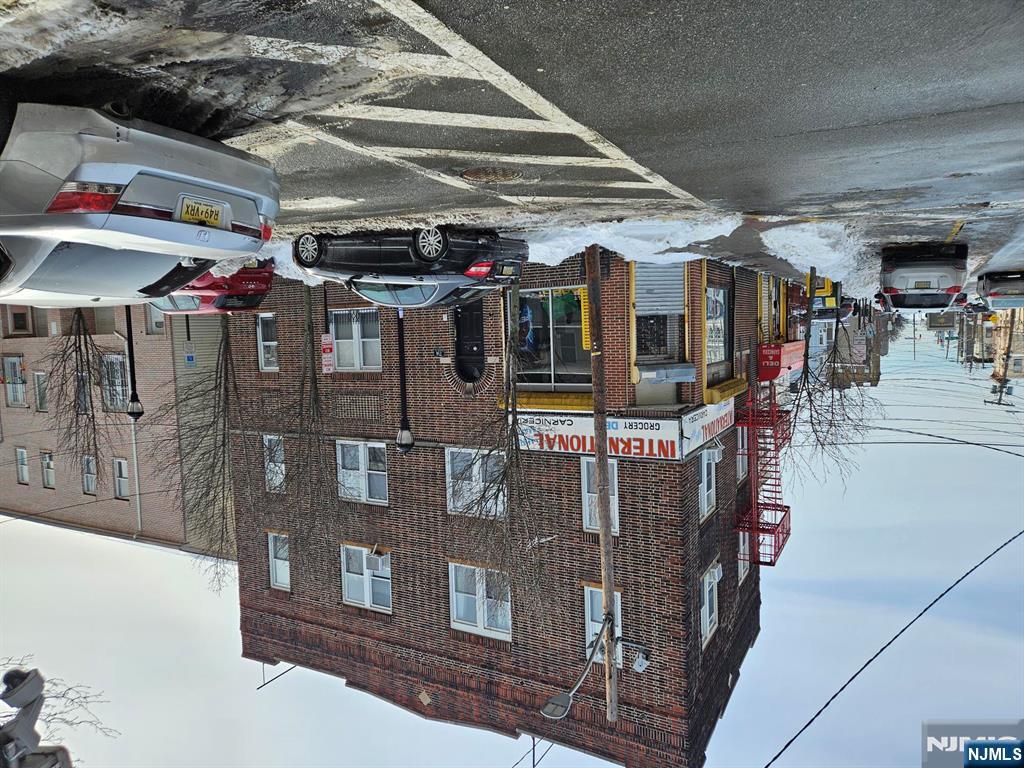 SOLID BRICK BUILDING AT 8TH. ST. AND BERGENLINE AVE, UNION CITY WITH SIX RESIDENTIAL UNITS AND ONE COMMERCIAL STORE WITH FULL BASEMENT