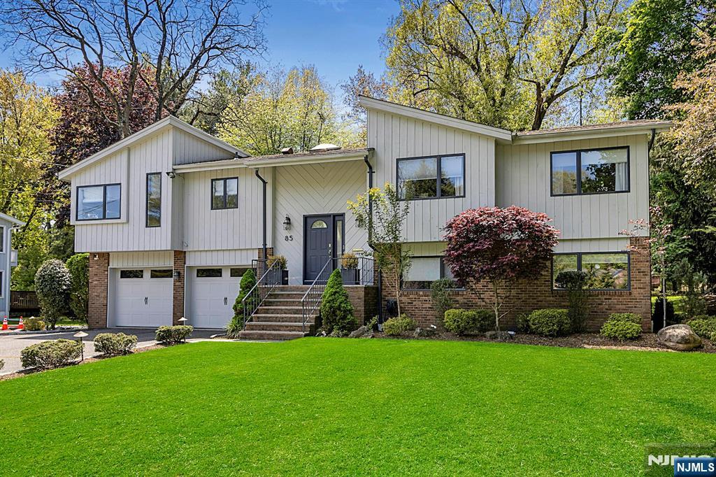 LOCATED ON A BEAUTIFUL CUL-DE-SAC, ON THE EAST HILL OF DEMAREST, SITS AN UPDATED 5 BEDROOM AND 3 FULL BATH HOME ON PARK-LIKE PROPERTY. THE HOME FEATURES A BRIGHT 2-STORY ENTRY FOYER WITH SKYLIGHT, HARDWOOD FLOORING THROUGHOUT, FORMAL LIVING ROOM WITH FIREPLACE, UPDATED KITCHEN WITH BREAKFAST AREA FLOWS EFFORTLESSLY INTO THE DINING ROOM WITH ACCESS TO A SPACIOUS DECK FOR OUTDOOR ENTERTAINING. PRIMARY SUITE WITH LARGE OUTFITTED WALK-IN CLOSET AND UPDATED SPA-LIKE BATHROOM, TWO ADDITIONAL BEDROOMS AND UPDATED FULL BATHROOM. WALK-OUT LOWER LEVEL WITH EXPANSIVE GREAT ROOM WITH ACCESS TO PATIO WITH FIREPIT AND BEAUTIFUL PROPERTY, OFFICE OR BEDROOM, ENSUITE GUEST BEDROOM WITH UPDATED BATHROOM AND PRIVATE ENTRANCE, LAUNDRY ROOM, STORAGE ROOMS AND TWO-CAR GARAGE. DEMAREST OFFERS BLUE RIBBON SCHOOLS, GREAT REC PROGRAMS, CLOSE TO SHOPPING, DINING AND EASY COMMUTE TO NYC!!