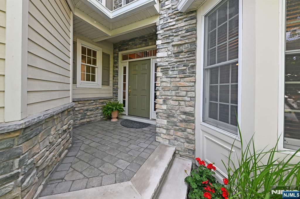 Rare opportunity to own in Orchard Hill, one of Upper Saddle River's most desirable communities. Tucked away in a quiet interior location, this spacious residence offers the perfect combination of comfort, convenience, and carefree living. Filled with natural light and featuring soaring ceilings, a fireplace, private patio, finished lower level, and attached two-car garage, this home delivers the feel of a single-family residence without the maintenance. Enjoy an exceptional lifestyle just one block from Upper Saddle River's acclaimed Lake Street Sports Complex, featuring pickleball courts, athletic fields, walking paths, and year-round recreation. Ideally located near top-rated Upper Saddle River schools, Northern Highlands Regional High School, shopping, dining, Route 17, and NYC transportation. With no other Orchard Hill homes currently available, this is a rare opportunity to own in one of Bergen County's most sought-after communities, where location, convenience, recreation, and exceptional schools come together.