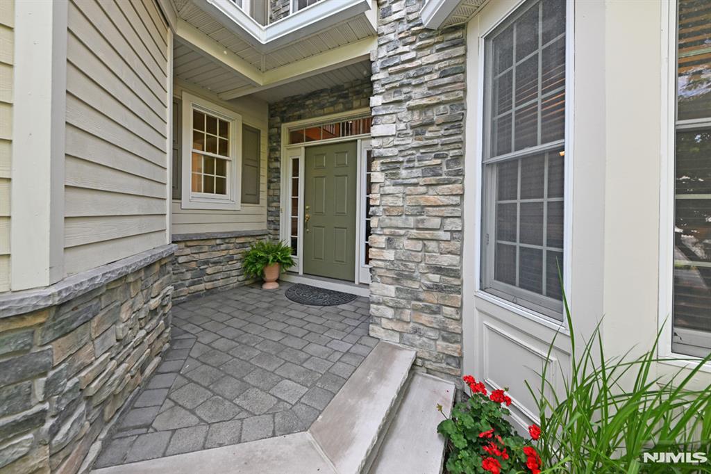 Rare opportunity to own in Orchard Hill, one of Upper Saddle River's most desirable communities. Tucked away in a quiet interior location, this spacious residence offers the perfect combination of comfort, convenience, and carefree living. Filled with natural light and featuring soaring ceilings, a fireplace, private patio, finished lower level, and attached two-car garage, this home delivers the feel of a single-family residence without the maintenance. Enjoy an exceptional lifestyle just one block from Upper Saddle River's acclaimed Lake Street Sports Complex, featuring pickleball courts, athletic fields, walking paths, and year-round recreation. Ideally located near top-rated Upper Saddle River schools, Northern Highlands Regional High School, shopping, dining, Route 17, and NYC transportation. With no other Orchard Hill homes currently available, this is a rare opportunity to own in one of Bergen County's most sought-after communities, where location, convenience, recreation, and exceptional schools come together.