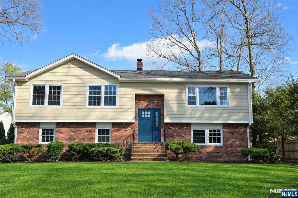 Beautifully renovated home set on a quiet cul-de-sac in the heart of East Hanover. This 4-bedroom, 2.5-bath home showcases exceptional craftsmanship, thoughtful design, and modern elegance throughout. The interior features a spacious primary suite with a private bath, rich hardwood floors, and an open, light-filled layout designed for both everyday living and entertaining. The gourmet kitchen is the centerpiece of the home, offering a center island, brand-new stainless steel appliances, and seamless flow into the dining room and inviting living room. The lower-level recreation room offers sliding doors to a private patio, creating a desirable indoor-outdoor living experience. Additional highlights include a brand-new central air conditioning system, all-new windows and roof, and a two-car garage accented with oversized custom wood doors and so much more. Ideally located near schools, shopping, and local parks. This move-in-ready home combines refined finishes, quality construction, and a sought-after location. Not in a flood zone.
