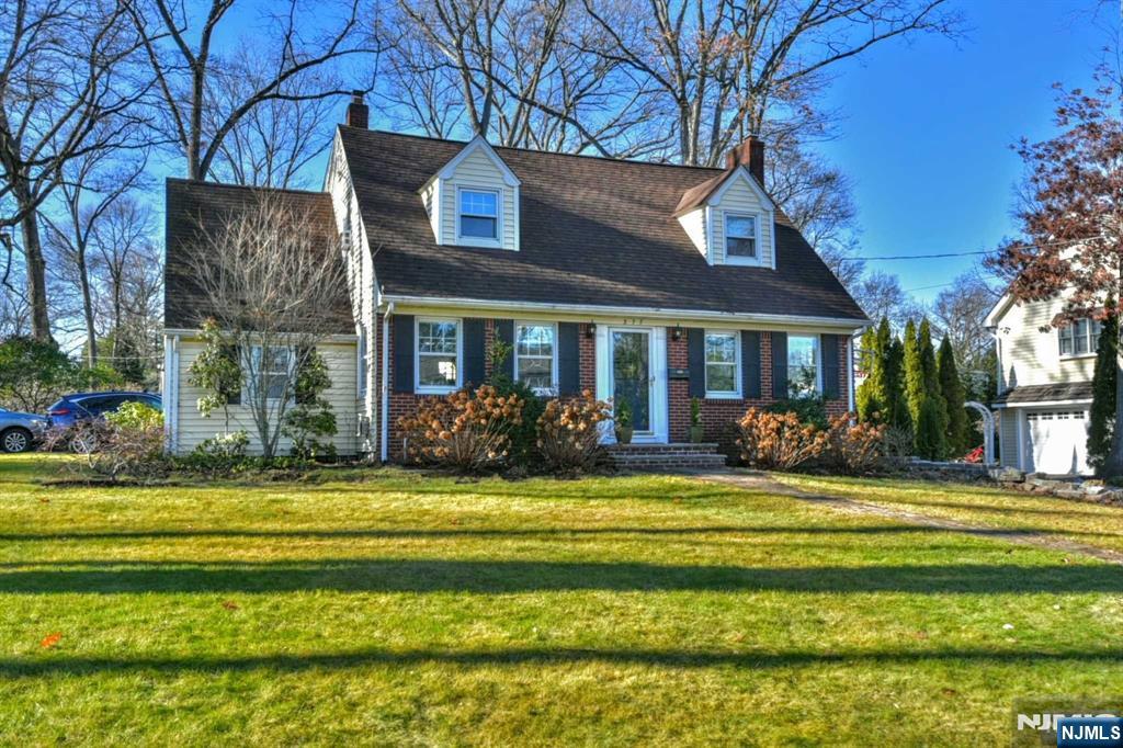 Come see this Charming Brick Front Center Hall Dutch Colonial with three bedrooms, two full bath, and a large, beautiful family room. This home boasts many windows, letting in lots of natural light. Hardwood floors throughout and a cozy fireplace in the living room. The family room has sliders that open up to a paver patio, perfect for outdoor barbequing and dining. Also a lovely, easy to maintain backyard with some timeless plantings. Lovely corner lot with lots of parking for guests. Wonderful family neighborhood where people take pride of their homes. Very Private Setting, lots of green space all around. Walk to shopping centers, schools, places of worship. Don't miss this chance to be in Wyckoff, close to everything!