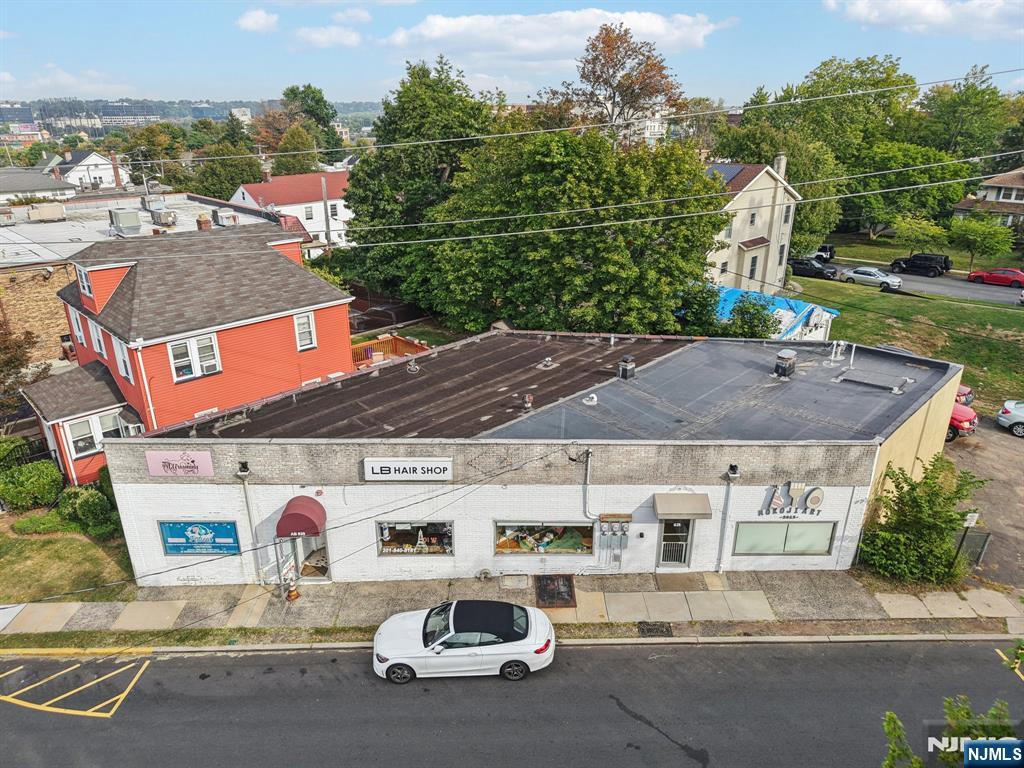 Excellent opportunity to lease a well-located retail or creative commercial space in a high-visibility setting with established neighboring businesses and steady foot traffic. Currently configured as a creative art studio, the space offers an open main area with great natural light, attractive storefront windows, hardwood floors, a welcoming reception/work area, private rooms for flexible use, a kitchenette, storage, and restroom access. This versatile layout may suit a variety of retail, studio, service, or professional uses, subject to landlord and municipal approval. Offered on a triple net lease basis, this is a great opportunity for a business seeking an inviting storefront presence in a thriving location.