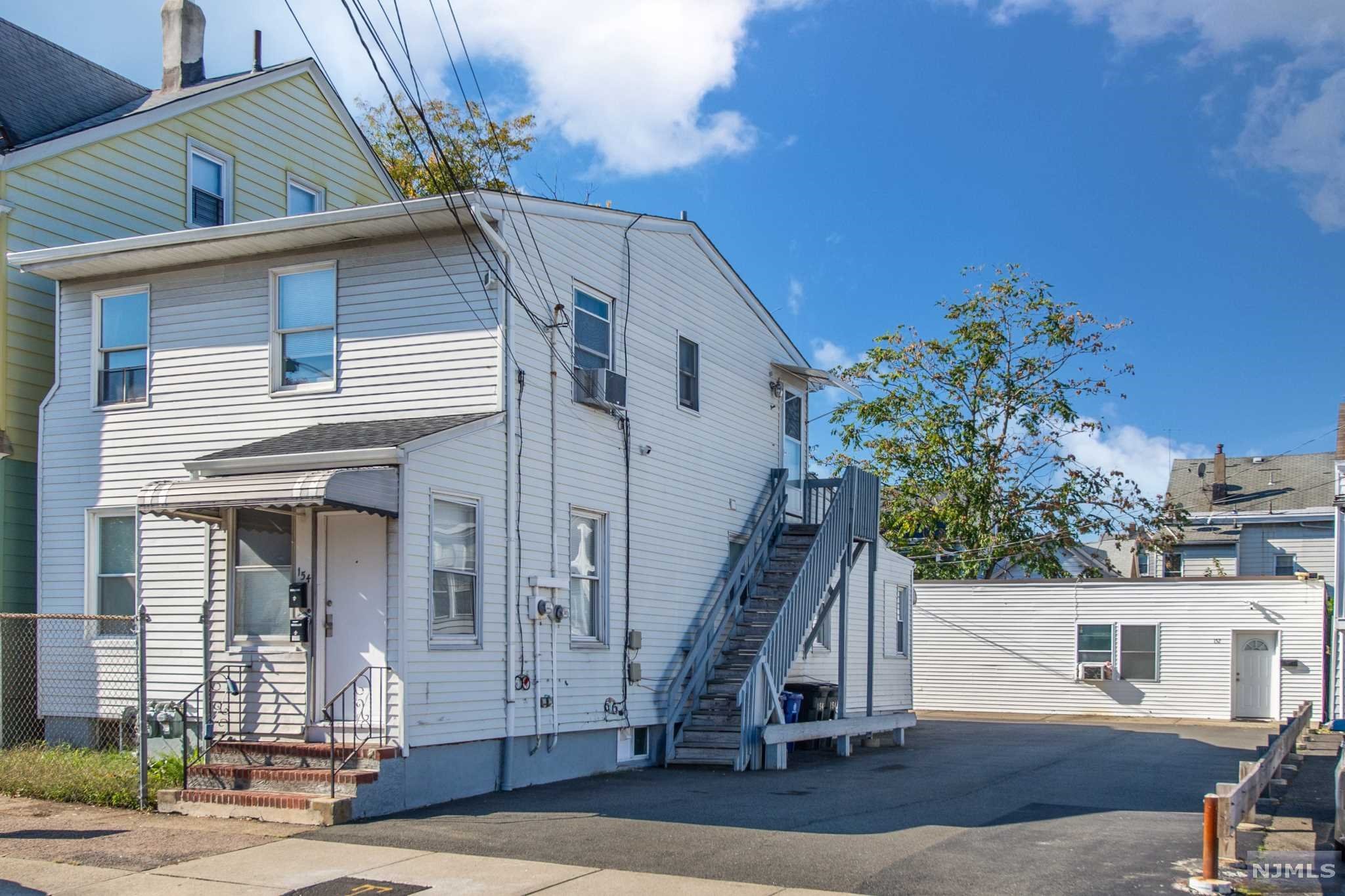 Here is your unique opportunity to own this 3 unit home consisting of two separate buildings, perfect for the owner occupant looking to live with costs covered or the investor to secure a stress free property! The main home offers two units: The updated first floor featuring three bedrooms along with two full baths. The bright and airy second floor apartment offers one bedroom and open kitchen area. The third unit is a separate ranch style home, which features an open floor plan with living room, dining room and kitchen, as well as a huge bedroom! This property is centrally located to major highways and NYC transportation.
