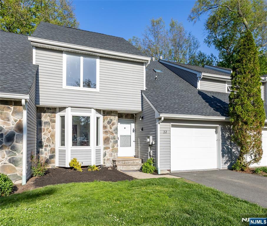 Welcome to this stunning, turn-key 3-bed, 2.5-bath townhouse in the highly sought-after French Hill Estates! Beautifully updated throughout, this home is truly move-in ready. The main level boasts a bright, open floor plan with a welcoming entry foyer, formal dining room, and an expansive living room centered around a cozy fireplace. The spacious eat-in kitchen features premium countertops, pristine cabinetry, and brand-new, never-used stainless steel appliances including a range, microwave, and dishwasher. A rear door leads out to a freshly repainted deck overlooking a peaceful outdoor area. The entire home has been freshly painted from top to bottom with a sophisticated neutral palette. Upstairs, discover brand-new upgraded flooring installed across all three bedrooms. The primary suite serves as a private retreat, offering three expansive closets and a full en-suite bath, while the two additional bedrooms provide ample closet space and bright windows. Excellent features include a convenient second-floor laundry room, a first-floor powder room, and an attached 1-car garage boasting freshly painted walls and a newly painted floor. Storage is unmatched with a massive crawl space providing humongous capacity. The monthly association fee ensures a well-maintained community by covering all snow removal, landscaping, and exterior building maintenance. Phenomenal location for commuters with the NYC express bus under a half-mile away and top-rated Wayne schools nearby.