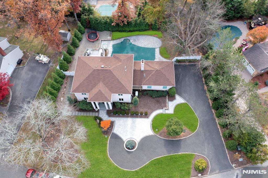 WELCOME TO THIS IMPRESSIVE CUSTOM COLONIAL IN NORTHERN RIVER VALES'S PRESTIGIOUS VICTORIA ESTATES! Itâ€™s unique Luxury appeal is enhanced by a circular drive w/Belgian block & the two-story entry foyer welcomes you in, setting the tone for sophistication in every room. Entertain in style in the banquet-sized dining room & gather in the expansive Great Room featuring a marble fireplace & wall of windows overlooking this private pool setting. Thoughtfully crafted with European influences, this contemporary kitchen is tailored for both serious cooking and gracious hosting. The breakfast bar and dining area open directly to the Great Room & rear outdoor living on deck & the stunning in-ground pool. A seamless setting for daily life & memorable gatherings is offered here. The main level also offers both a bright office/formal living room & a private guest suite with a full bath. Upstairs, the huge primary suite is complete with an oversized master bath & generous walk-in closet, plus 2-3 bedrooms ensuite. The large basement expands your living space, featuring a sauna, full bath, private office, and direct access to the pool & rear yard. Conveniently located near top rated schools, parks, shopping and easy NYC transportation. This home combines luxury and convenience in one exceptional package. This home truly has it allâ€”donâ€™t miss the chance to make it yours!