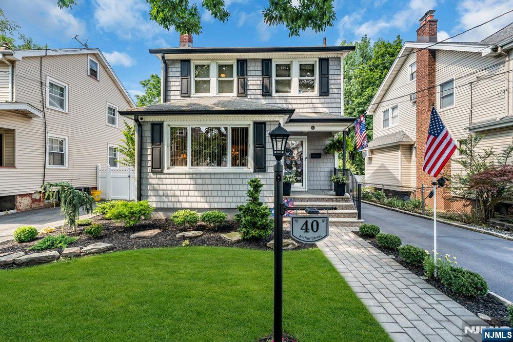 This beautifully maintained Colonial combines timeless charm with thoughtful modern updates. The first floor features a spacious living room accented by a stone-front fireplace and a large archway window that connects the dining room with living room. The updated kitchen offers stainless-steel appliances, generous counter space, and convenient access to the backyard. There is an addition dining area coming off the kitchen which is great for casual meals. Upstairs are three comfortable bedrooms and a full bath. The finished basement provides a versatile bonus area ideal for a home office, gym, or recreation room, along with extra storage and laundry. Enjoy outdoor living in the private fenced yard with a patio, above-ground pool, and detached garage. A paved driveway provides ample off-street parking. Ideally located near local parks, schools, shopping, and NYC transportation, this move-in-ready home offers comfort, character, and convenience in one great package!