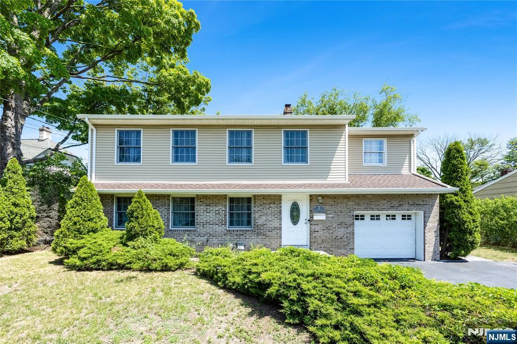 Charming colonial nestled on a quiet residential street in the heart of Ridgewood! This well maintained 3 bedroom, 2.5 bath home offers a functional layout with spacious living area, abundant natural light, and timeless curb appeal. The first floor features a welcoming living room, formal dining room, full bathroom, and an updated kitchen perfect for everyday living and entertaining. Upstairs offers generously sized bedrooms and comfortable living. The fully finished basement provides additional flexible space idea for a playroom, sitting room, gym or home office. Enjoy the convenience of an attached garage, private driveway, and beautiful sized yard perfect for outdoor gatherings or relaxing evenings. Close to parks, shopping, dining and highly regarded schools. this home is a fantastic opportunity to move into one of Bergen County's most desirable neighborhoods.