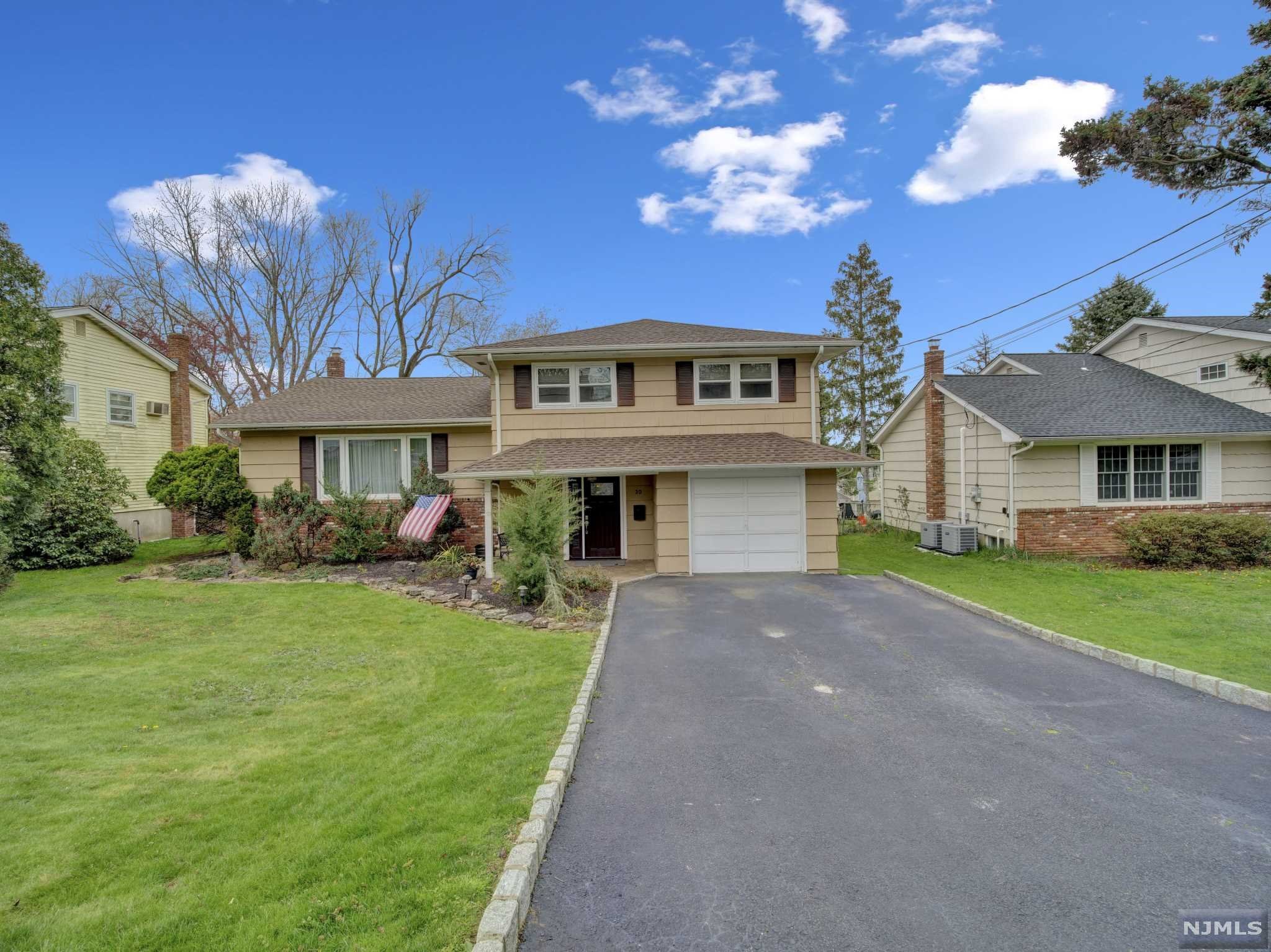 Sitting on a sprawling quarter acre sits this immaculately kept 3-bedroom split! This home features a large living room and dining room on the first floor along with a family room on the ground floor. Home features a true master bedroom with an en suite along with generously sized bedrooms. Enormous back deck overlooks large backyard backing up to one of Roseland's finest neighborhoods. Close proximity to NYC transportation on Eagle Rock Ave along with the center of town. Roseland features a perennial top school district and low taxes!