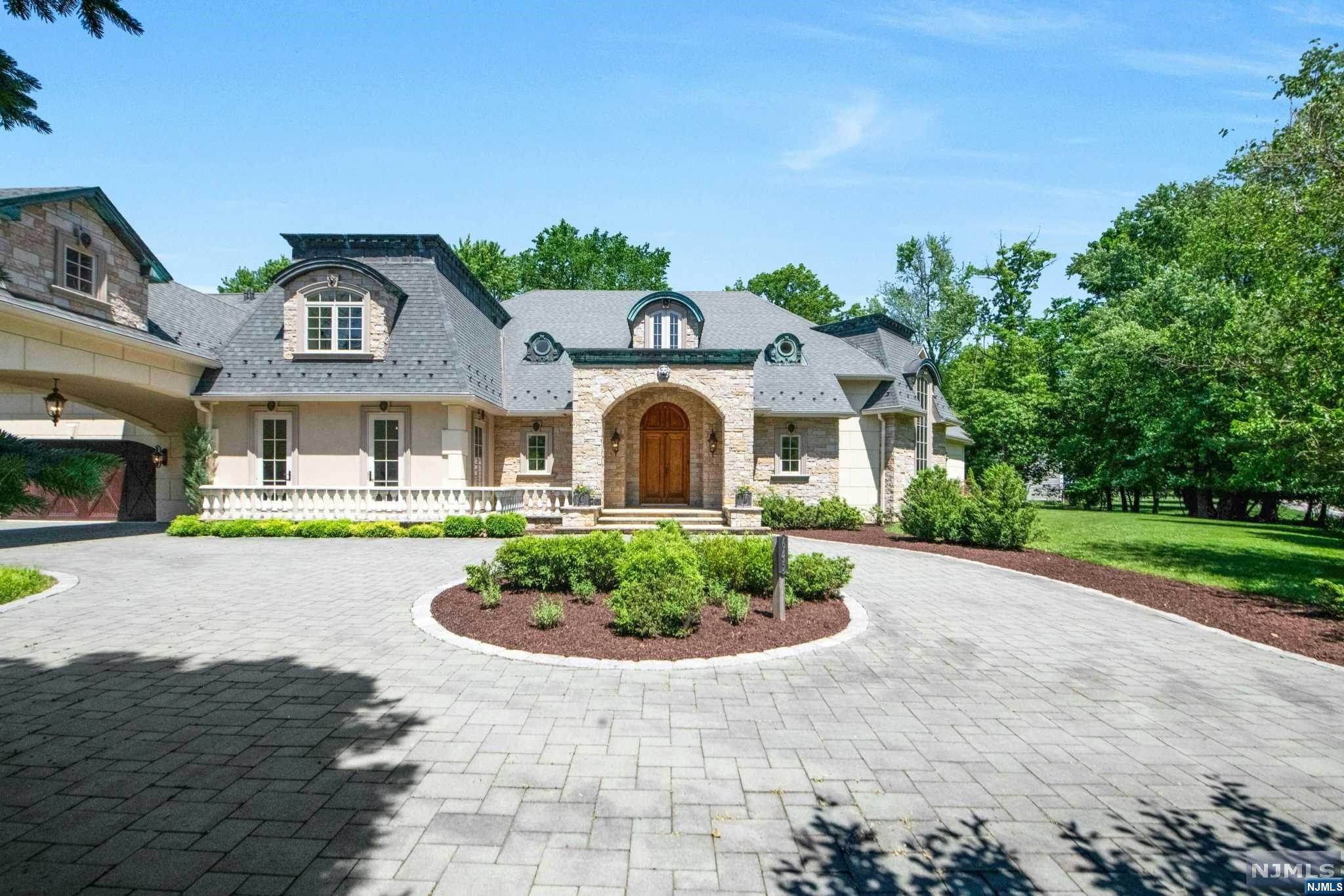 Come and experience the magic of this extraordinary estate where history meets luxury in perfect symphony.This custom built French Chateau exudes elegance and sophistication and is sure to delight even the most discerning buyers.The dedication, care and attention to detail in this home is unrivaled with impeccable quality of craftsmanship.step through antique front door into a world of refined elegance.The foyer welcomes you with its soaring ceilings,and magnificent marble bridal staircase. 2 story kitchen includes Clive Christian cabinets, island and top of the line appliances. Beautiful fam. room with cathedral ceiling and 18th century imported wood burning fireplace.The spacious primary suite offers a spa like bathroom with a marble soaking tub, custom vanities and a gorgeous walk in closet.Beautiful grounds with a covered patio, outdoor kitchen, a marvelous pool, and lush gardens provide a tranquil escape, perfect for gathering. Custom windows and doors, radiant heat and mor