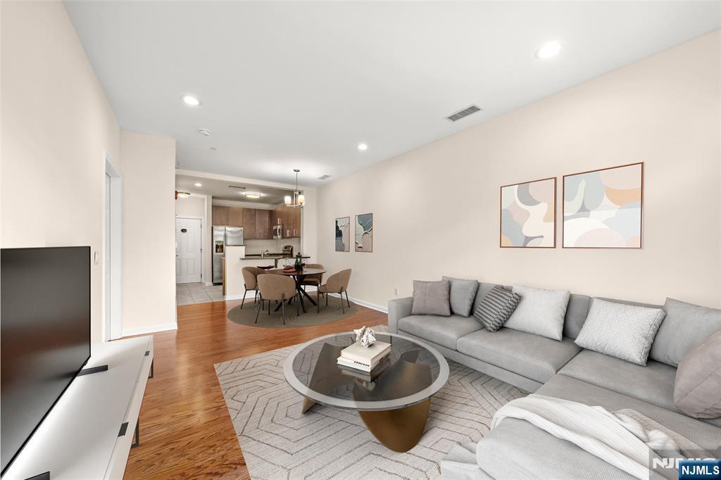 Impeccably maintained and truly move-in ready, this stunning 1BR/1.5BA unit at The M at Englewood South offers 840 sq ft of thoughtfully designed living space. Enjoy an open-concept layout with recessed ceiling lights, hardwood floors, and large windows that provide both natural light and complete privacy with serene views. The modern kitchen features granite countertops, stainless steel appliances, and a breakfast bar that flows seamlessly into the spacious living and dining areas. The primary suite boasts a walk-in closet and a private en-suite bath. Additional highlights include a guest powder room, coat closet, linen closet, and in-unit washer/dryer â€” offering comfort, function, and style in one perfect home. The monthly HOA includes Water, Heat, Cable/Internet, One Indoor Parking Space, and use of all community amenities â€” only electricity is separate. Residents enjoy access to an outdoor pool and clubhouse. Ideally located just minutes from Downtown Englewood, fine dining, shopping, parks, and the George Washington Bridge.