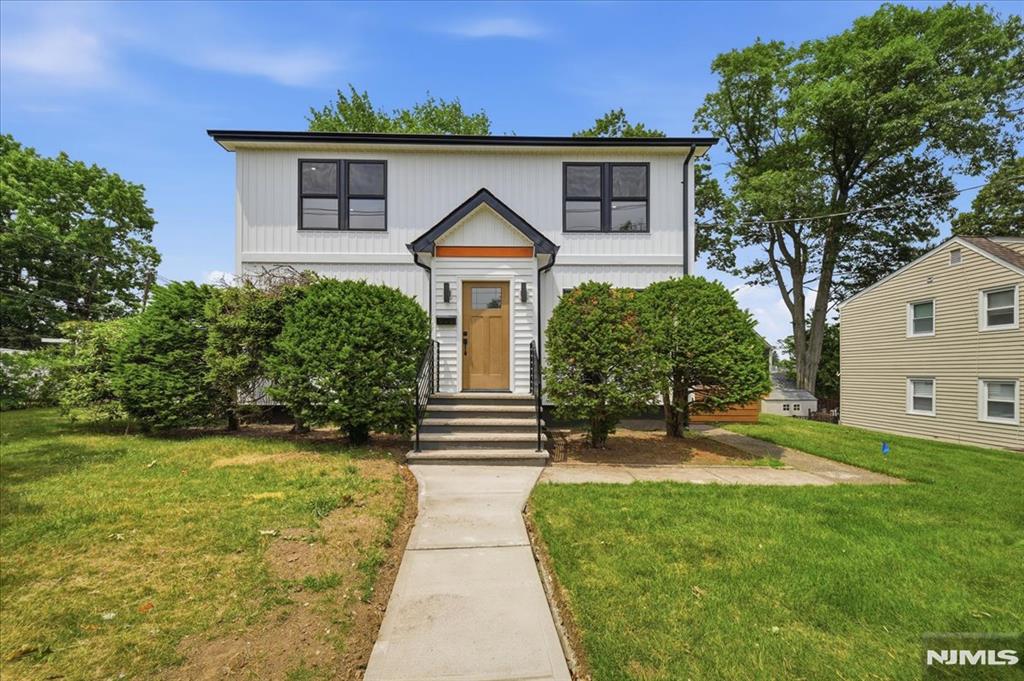 Fully renovated inside and out, this stunning 4-bedroom home combines modern style with exceptional functionality. Sun-filled and thoughtfully updated, it features beautiful wood flooring throughout and high-end finishes at every turn. The spacious first floor offers a bright living room, a beautifully designed oversized kitchen with abundant space for cooking and entertaining, one generously sized bedroom, and a full bathroom ideal for guests. Upstairs, you'll find three additional bright bedrooms, including a luxurious primary suite with its own private ensuite bath. Every room showcases quality craftsmanship, contemporary design, and attention to detail. the finished basement has lots options and has a door to the outside. The Garage has a finished room with a separate entrance-perfect for an office/gym or creative space. Move-in ready and renovated from top to bottom, this exceptional home delivers comfort, style, and versatility in every space.