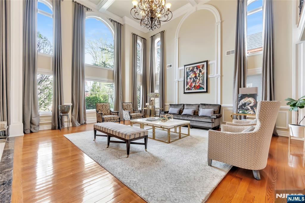 1115 Briar Way, located in Fort Leeâ€™s sought-after Bluff section, sits on an oversized lot and offers more than 7,000 square feet of beautifully designed living space. This impressive five-bedroom home blends timeless elegance with modern comfort. The first floor features a dramatic two-story foyer, a spacious great room, and a chefâ€™s kitchen outfitted with custom cabinetry, premium appliances, and a butlerâ€™s pantry. Additional highlights include a formal dining room, private office, family room, and powder room. Upstairs, the luxurious primary suite offers a sitting area, private terrace, two walk-in closets, and a spa-inspired bathroom. This level also includes three additional ensuite bedrooms with generous walk-in closets, along with a convenient laundry room. The fully finished lower level is designed for both relaxation and entertainment, featuring a gym, a dedicated theater room, recreation space, bonus room, an additional bedroom, and a full bath. The backyard is a tranquil retreat, complete with a pergola, outdoor kitchen, heated in-ground pool, and a beautifully crafted paver patioâ€”perfect for entertaining or unwinding in style.