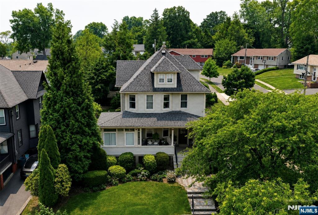 A classic American Foursquare circa 1916, this lovingly maintained home was built for making memories in beautiful Oradell. A timeless, traditional layout across four floors and solid construction, using quality materials that have stood the test of time. From the lemonade porch to original stained glass windows, gleaming hardwood floors, and elegant mahogany moulding, this home is brimming with character, craftsmanship, and charm. First floor features an eat-in kitchen with custom built-in bench seating, a formal dining room and living room, a powder room, and a three seasons room / playroom. On the second floor, thereâ€™s a primary bedroom, two additional bedrooms, a full bathroom, and an extra room (nursery/guest room or potential walk-in closet). Above features a finished attic with an office and ample storage. A finished basement was built on the bottom floor thanks to the homeâ€™s younger foundation, courtesy of a site relocation when neighboring homes on Beatrice Place were developed in the 1960s. The basement also includes a full bathroom and a laundry room with Speed Queen washer and dryer. Additional amenities including central air conditioning; hardwired smoke and carbon monoxide alarms; a professionally-monitored security system; an EV charger; and a backyard shed with shelving, lighting, and hardwired smoke detector. Meticulously landscaped lot that backs up to a quiet cul-de-sac, and provides easy access to top-rated schools and multiple commuting options.
