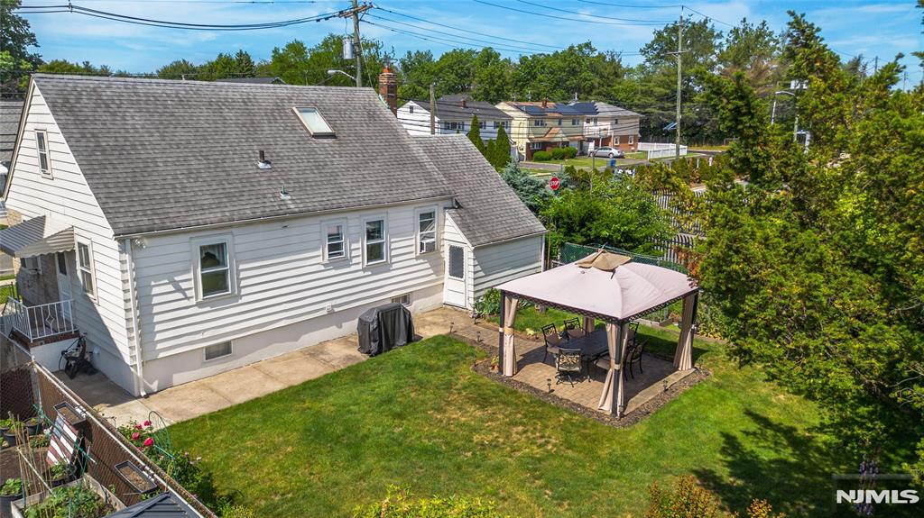 Why rent when you can own this charming and well-maintained Cape Cod that's ready for you to move right in! This inviting home offers the perfect blend of comfort, value, and convenience. Enjoy outdoor living in the fabulous fenced in yard featuring beautiful perennial gardens, a dedicated garden area, and a paver patio w covered arbor perfect for relaxing or entertaining. Inside, you'll find gleaming hardwood floors, recessed lighting, tilt-in replacement windows, a brand-new heating furnace, and a newer hot water heater. The main level features a formal living room, an eat-in kitchen, two comfortable bedrooms, a full bathroom, and convenient walkout access. The spacious second level offers a huge third bedroom with skylight for abundance of natural light and flexible extra space for a home office, sitting area, or hobby area. The full basement includes a recreation room, providing additional living and entertaining space. A driveway for off-street parking leads to the attached garage with auto opener and access to yard for added convenience. Ideally located just steps from the Delawanna Train Station and close to shopping, restaurants, and major highways, this home offers an easy commute and convenient lifestyle. A Must See!