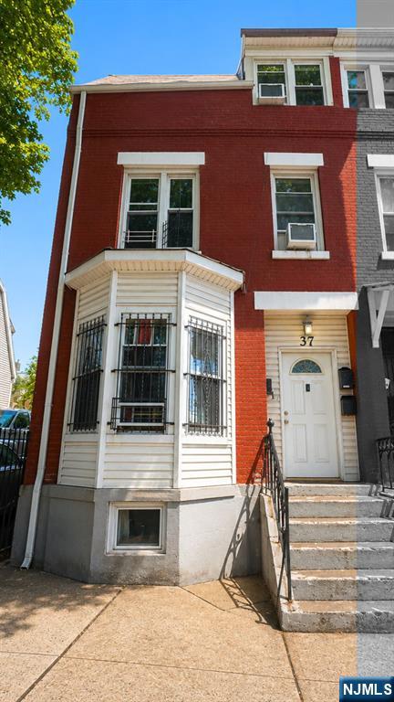 Welcome to this stunning brick brownstone nestled in the heart of Newark, NJ. This fully updated 2-unit multifamily exudes that coveted NYC and Jersey City brownstone charm, sitting on an 18x100 lot featuring a full basement and parking. Thoughtfully renovated in 2025 with modern finishes throughout, both units are currently tenant occupied and generating consistent rental income from day one. Perfect for the seasoned investor seeking immediate cash flow or an owner-occupant looking to live in one unit while collecting rental income from the other. Experience the charm and character of classic brownstone living at a fraction of NYC and Jersey City prices with low 2025 taxes. Conveniently located with easy access to major highways and NJ Transit for a seamless commute to NYC. Property can be purchased individually or as part of an exclusive package deal with 4 additional side-by-side brick brownstones on S 12th St, totaling 5 properties. Opportunities like this do not last. Schedule your showing today.