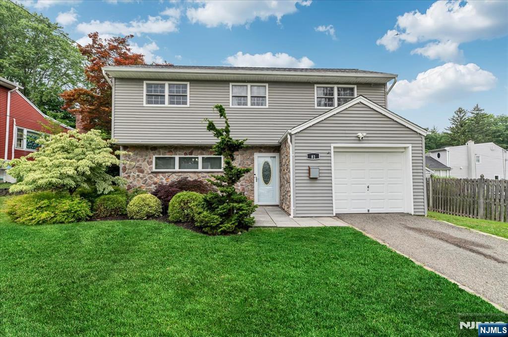 Beautifully updated & move-in ready, this exceptional home is ideally located on the desirable Kinnelon side of Butler in the private Lake Edenwold community. Step inside to an inviting Family Room w/ convenient Powder Room before entering the impressive main living level, where a contemporary open-concept design seamlessly connects the Dining Room, Living Room & Kitchen, creating the perfect setting for everyday living & entertaining. Cathedral ceilings & abundant windows fill the space w/natural light, while an walkout leads to the fenced backyard & beautiful patio, ideal for outdoor gatherings. The stylish Eat-in Kitchen features gorgeous wood cabinetry, granite countertops, SS appliances & a breakfast bar w/seating for four. Upstairs, you'll find three good sized Bedrooms & a Full Bath w/tub/shower. Wood floors & recessed lighting add warmth & style throughout, while the basement offers a dedicated Laundry Room & ample storage. Optional Lake Edenwold membership offers access to the beach, swimming, boating, catch-and-release fishing, pavilions, scenic waterfalls & year-round community activities. Newer roof 2021. Convenient to Routes 287 & 23, shopping, restaurants & more! Close to NYC bus.