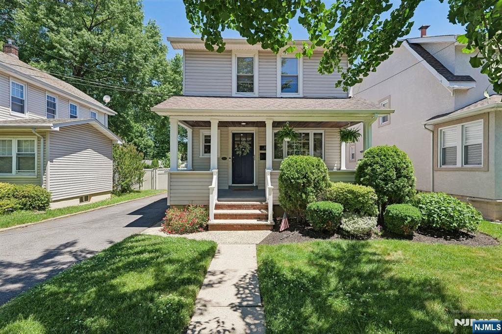 Just a stone's throw from Memorial Park, this renovated 3 bedroom side-hall Colonial combines timeless charm with today's modern conveniences. A welcoming open front porch greets you upon arrival, offering the perfect spot to enjoy your morning coffee or unwind at the end of the day. Inside, the open-concept layout creates an effortless flow between the living and dining areas, ideal for both everyday living and entertaining. The beautifully updated kitchen serves as the heart of the home, featuring a center island, stunning quartz countertops, and ample space for gathering. Upstairs, three comfortable bedrooms provide peaceful retreats, while the finished basement offers valuable bonus space perfect for a home office, gym, or playroom. Step outside to a fully fenced backyard complete with a new concrete patio, creating a private outdoor oasis for dining, relaxing, and entertaining all season long. Conveniently located on a charming tree-lined street near parks, Starbucks, transportation and dining, this move-in-ready home offers the perfect blend of character, functionality, and location in one of Nutley's most desirable neighborhoods.