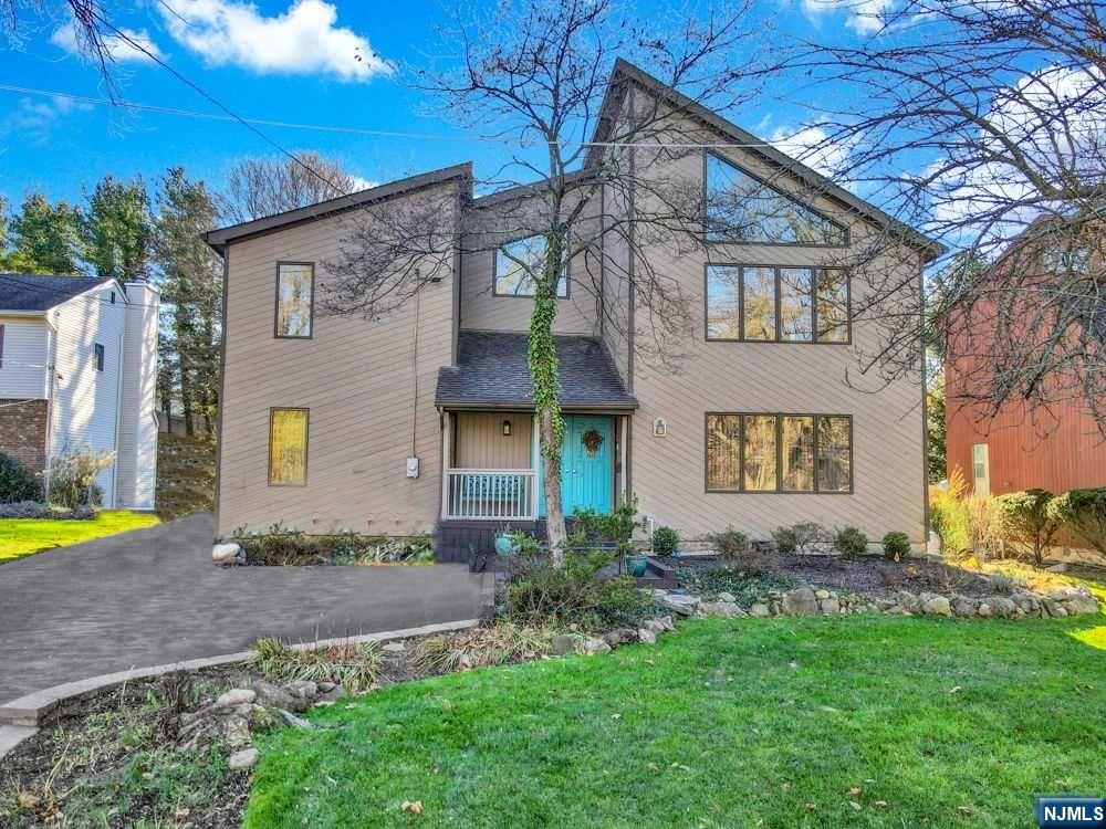 Impeccable and lovingly maintained 2,500+ sq. ft. Contemporary style home with two separate living areas! New hardwoods welcome you into a spacious entry foyer. Loads of natural light in the open liv rm/dining area w/lovely views of Mirror Lake! Two bedrooms, full bath, kitchen and sunroom w/door to deck complete first floor.2nd level has two bedrooms, dramatic vaulted ceiling in a spacious light and open liv rm/din area combo, kitchen and full bath! 2nd floor deck off kitchen! Full basement with rec room, gym, storage, laundry and utilities. Wonderful rear yard has detached garage, inground pool and large lawn area! Mirror Lake located on Seminole Avenue and across from the house, is a quiet, serene 3.6 acre recreational lake with catch-and-release fishing. You will feel like Country living rear round. Oakland has an excellent school district and rec programs. Convenient to NYC transp.,and easy commuting from nearby Rts. 208 and 287! New septic being installed!