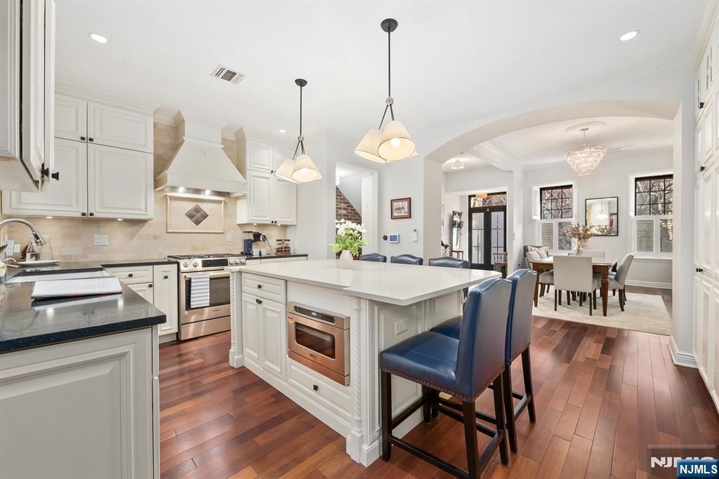 Welcome to 944 Bloomfield Street, a renovated five-bedroom, three-bathroom Hoboken Brownstone that blends historic character with cutting-edge comfort. This spacious residence offers a flexible multi-level layout with two private entrances, an original staircase and banisters, and exposed brick. The stunning parlor level features radiant heat, a chefâ€™s kitchen with Bosch and Viking appliances, a six-seat island, deep pantry cabinets with ample storage, wine racks, and a Juliet balcony. The garden level includes radiant heat, new engineered hardwood, an ADA-friendly bathroom with roll-in shower and Toto toilet/bidet, a home-theaterâ€“style media setup, and a recreation room that opens through a custom 10-foot slider to a fully private backyard designed by Hufnagel, complete with turf, excellent drainage, thriving River Birch, and peaceful privacy. With two generous top-floor bedrooms sharing a Jack-and-Jill bath with radiant heat, a tranquil primary suite with a spa-inspired ensuite, and exceptional sound insulation that eliminates both neighbor noise and internal noise transfer. Additional highlights include keyless entry on both doors, hidden garbage/recycling storage, a soldered iron loop for bikes/strollers, quiet Lutron whole-house smart switches, a full-home water filtration system, and a dry basement that sits outside the flood zone. This classic brownstone living is elevated by cutting-edge modern comfort.