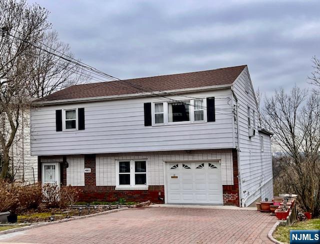 This split level home offers over 4,000 square feet of space and is perfectly positioned to capture stunning westerly views of the Meadowlands, delivering breathtaking sunsets every evening. Featuring 4 spacious bedrooms and 3 full bathrooms, the layout is both versatile and inviting. One bedroom is set on its own private level alongside an expansive family room, complete with sliding doors that lead out to a beautiful Trex deck. Perfect for relaxing or entertaining. The upper level hosts three additional bedrooms, including a primary with its own full bath, plus a well-appointed hall bathroom. The main floor boasts an updated granite kitchen with an open concept design that flows seamlessly into a generously sized living and dining area. Ideal for gatherings and everyday living. On the first level, youâ€™ll find a welcoming entry foyer with a walk-in closet, a full bathroom, a den or home office, and a convenient laundry room. The attached one-car garage provides direct access to an enormous basement featuring approximately 19-foot ceilings, offering incredible space for a workshop, storage, or future possibilities. This is a home you truly have to see to believe.