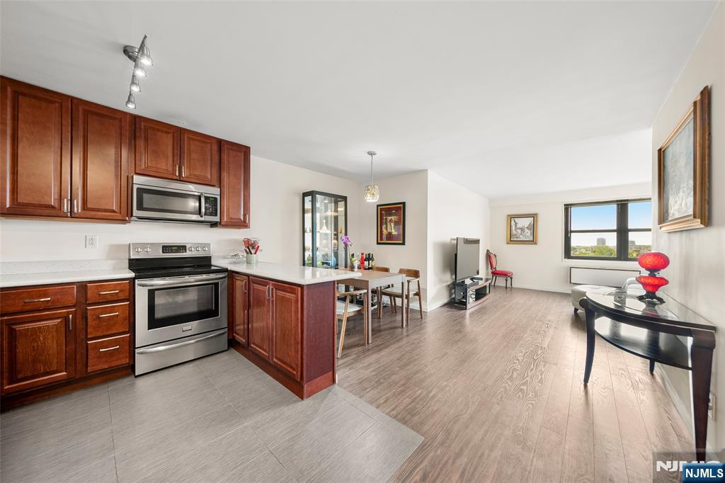 Modern 1 Bedroom Condo with Stunning NYC & Hudson River Views Parker Imperial | Prime Boulevard East Location | North Bergen Located on sought-after 79th Street in vibrant North Bergen, this bright and spacious 1-bedroom condo offers breathtaking views of the Manhattan skyline, Hudson River, Empire State Building, and Hudson Yards â€” all just minutes from NYC via convenient bus or ferry access. Situated steps from the 167-acre park with lake, tennis and pickleball courts, this is urban living with nature right outside your door. Apartment Highlights: Bright open-concept layout with beautiful natural light Modern kitchen with quartz countertops, stainless steel appliances, breakfast bar, and ample dining space Spacious living/dining area with laminate flooring over hardwood Large bedroom with walk-in closet, tiled floors, and spectacular Southeast skyline & river views Updated bathroom with sleek, contemporary finishes Incredible views of the Empire State Building and Hudson Yards from both living room and bedroom Building Amenities â€“ The Parker Imperial: 24-hour doorman and garage attendant Secure package room On-site fitness center with his/hers saunas and showers Laundry room on every floor (2 washers and 2 dryers) 1 assigned indoor garage parking space Outdoor heated swimming pool On-site management and live-in superintendent Free access to tennis/pickleball in neighboring 167-acre park with lake Transportation to NYC, Hoboken, and Jersey City at your doorstep Close to