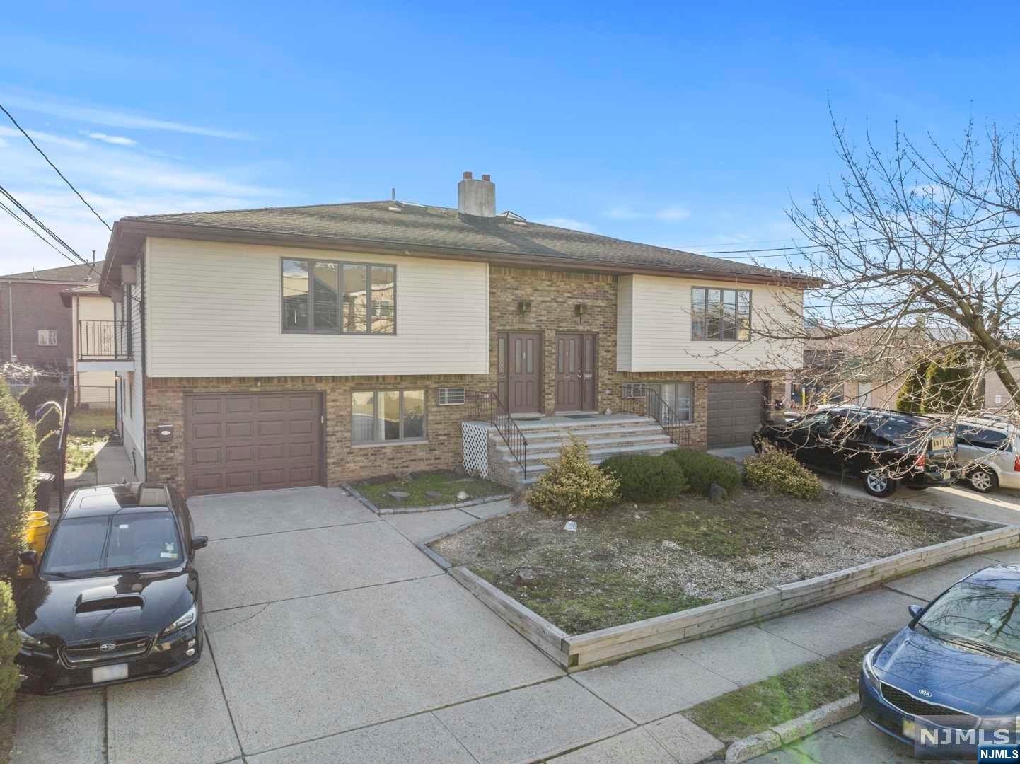 Well kept and maintained two family house in Palisades Park on an oversized lot. This unique property consists of an extra large 4 bedroom unit that is two levels. This unit has 1 full bath, 1 half bath, and garage. The second unit is a 1 bedroom unit on the ground level. Please take a look at the virtual tour and floor plans to appreciate this unique property. Also for sale is 132A Roosevelt which is the identical layout next door MLS#23005250. Lot size is 8600sqft with both properties together.