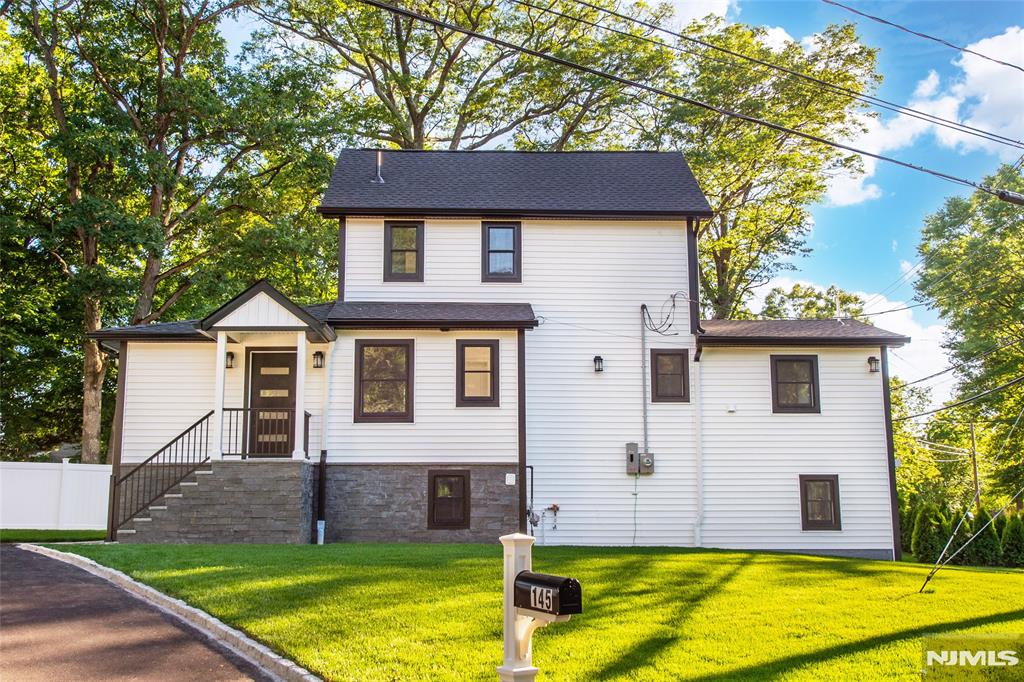 Completely renovated from top to bottom, this approx 2500 sq ft stunning home offers 4 bedrooms, 3 full and 1 half bath, combining modern design, and quality craftsmanship.Extensively renovated throughout, nearly every major component has been updated, including a new roof, Andersen windows, electrical, plumbing, HVAC, and a new 200-amp electrical service. Offering the peace of mind of a newer home, this property is truly move-in ready. A new driveway, professional landscaping, underground sprinklers, lush new sod, a composite deck, EV charger locker room, and a spacious paver patio create exceptional curb appeal and complete this remarkable transformation.Designed for today's lifestyle, the open-concept main level features a spacious living room, dining area, and beautifully appointed kitchen with shaker cabinetry, quartz countertops, stainless steel smart Wi-Fi appliances, a center island, and seamless flow for everyday living and entertaining. The highly desirable first-floor primary suite offers privacy and convenience with a beautifully finished en-suite bath.The thoughtfully designed floor plan provides exceptional comfort and functionality, with a bathroom on every level. Upstairs, generously sized bedrooms offer ample space for family and guests. The finished lower level adds living space and flexibility, making it ideal for extended family, guests, or a recreation room. Taxes are estimated to be between $8,000-$9,000 per Mahwah tax assessor, will be finalized in July