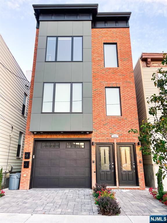 Enjoy luxury living in this fantastic area of Jersey City Heights! This spacious duplex condo will make you feel right at home, featuring 2 levels of living space, 1,919 SQFT and Central Air & and beautiful fenced-in back yard. Enter the first floor and find an open family room with half bath, washer and dryer, sliding door to the backyard, with one car garage. Walk up to the second floor where youâ€™ll be welcomed by open concept living room/kitchen/dining area, 3 bedrooms, 2 baths, stainless steel appliances, wood floors throughout, recessed lighting and lots of natural light. Conveniently located walking distance to Congress Light rail, Central Ave shops, banks, restaurants, cafes, stores, local and NYC transportation, a stoneâ€™s throw to Hoboken & Journal Square, schools and houses of worship & parks. The property is currently rented for $5k per month. The monthly HOA is $194.75 to cover insurance and water. Donâ€™t miss out this great opportunity to own this gorgeous condo!