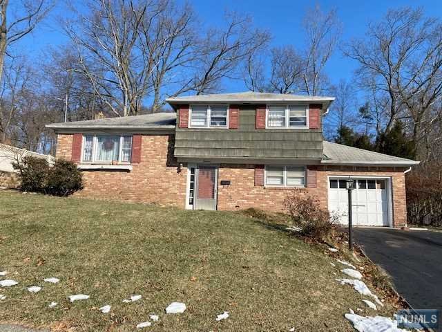 Great location for this "split level" facing East with view, 3 bedrooms, 1.5 baths, spacious family room with sliding door to "all seasons room". House needs improvements. "SOLD AS IS" and buyer is responsible for all inspections and certificates.