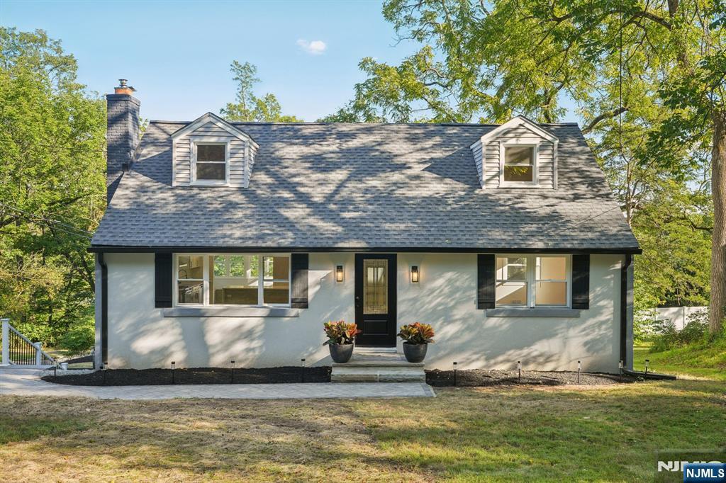 Get ready to be amazed by this stunning, newly renovated Cape Cod, perfectly positioned directly across from the prestigious Spring Brook Country Club! Prepare to be captivated by the home's expansive, open-concept design, where every detail has been meticulously crafted to enhance both space and functionality. Step into a culinary haven with the newly renovated kitchen, providing an abundance of room for unforgettable gatherings and delicious meal preparations. The sunroom is an inviting space, transforming your dining experience into a seamless blend of indoor comfort and outdoor charm. The heart of the home, the newly designed living room, boasts an inviting fireplace, offering ample space to entertain cherished guests or unwind in comfortable relaxation. The first-floor primary bedroom carries forward the theme of spaciousness, providing a versatile sanctuary ideal for lounging in leisure or focusing on productive work. The walkout basement invites endless entertainment possibilities, effortlessly transitioning between indoor and outdoor enjoyment. Step into a spacious backyard, where a brand-new composite deck beckons, creating an ideal space for outdoor gatherings. Rest easy knowing that this home is equipped with a brand-new AC unit and furnace, ensuring year-round comfort and efficiency. This exceptional property is also conveniently situated within just 2 miles of the vibrant downtown area of Morristown. Use 268 Mt. Kemble Ave for GPS