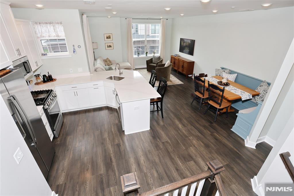 Gorgeous Turn-Key Townhome in a prime location. This well-maintained 3 bedroom, 2 and a half bath, townhome offers the perfect blend of modern luxury and unbeatable convenience. At just 3 years young, the property still feels brand new and features a custom built in dining banquette that maximizes the space and adds a high-end flair. It's also equipped with custom window treatments saving you time and added expense. You'll find three spacious bedrooms with ample closet space, ensuite bath and large hall bath on the second floor as well as a large common space ideal for a family room, office or library. A private driveway and built in garage complete the space. Situated close to the center of town, you are just a few minutes away from local shopping, dining and vibrant community life. Best of all, it offers an effortless commute to NYC making it a dream for commuters looking for proximity to the city without sacrificing suburban comfort.