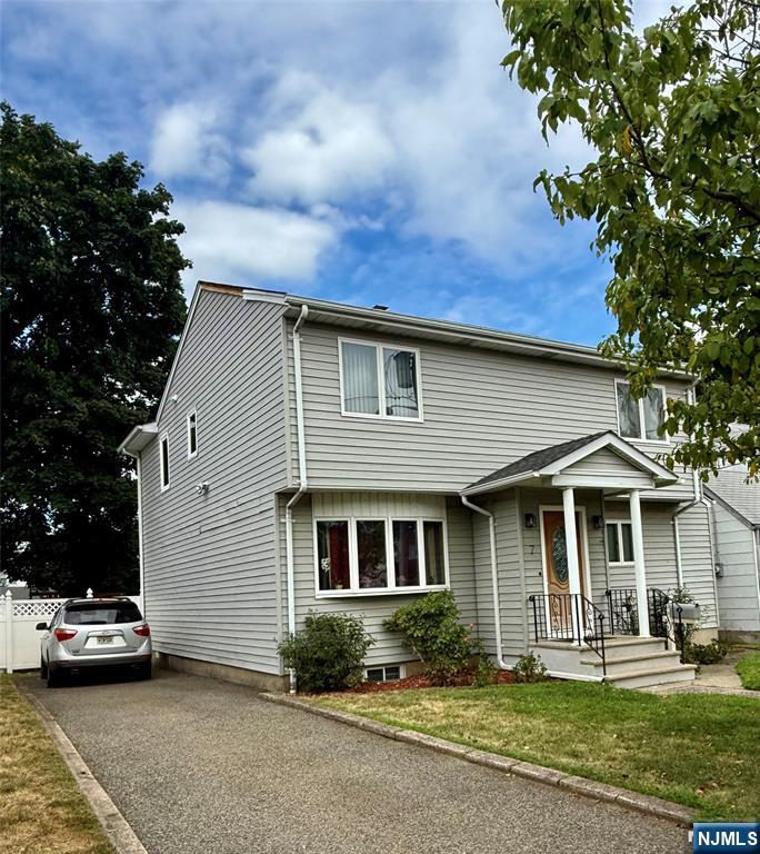OPEN HOUSE SUNDAY 8/24 from 12-2 pm. Come and see this spacious, bright and updated 4 bedroom, 3 full bath colonial style whole house rental in a wonderful residential neighborhood. Prime location within close proximity to all major highways plus both express bus and NYC Train. Enjoy the many fabulous multi-cultural restaurants and all the conveniences the area has to offer. This spacious home features 1st floor living room, family room, full bathroom, dining room, updated 3 year new kitchen with refrigerator, gas oven and dishwasher provided. A 2nd Full bathroom and 3 extremely large bedrooms: 15'8x13'4, 17'6x9'9, 11'4x8'4, plus a Primary bedroom with private en-suite bath18'10" x 17'7" completes the 2nd level. Additional space can be found in the finished basement providing plenty of storage plus a laundry area with washer and dryer included. Special features include 2 zone central a/c, central vacuum, fenced yard, rear deck & multi-car driveway. Landlord will provide lawn maintenance, tenant responsible for snow removal and all utilities. No pets permitted! Available September 1st.