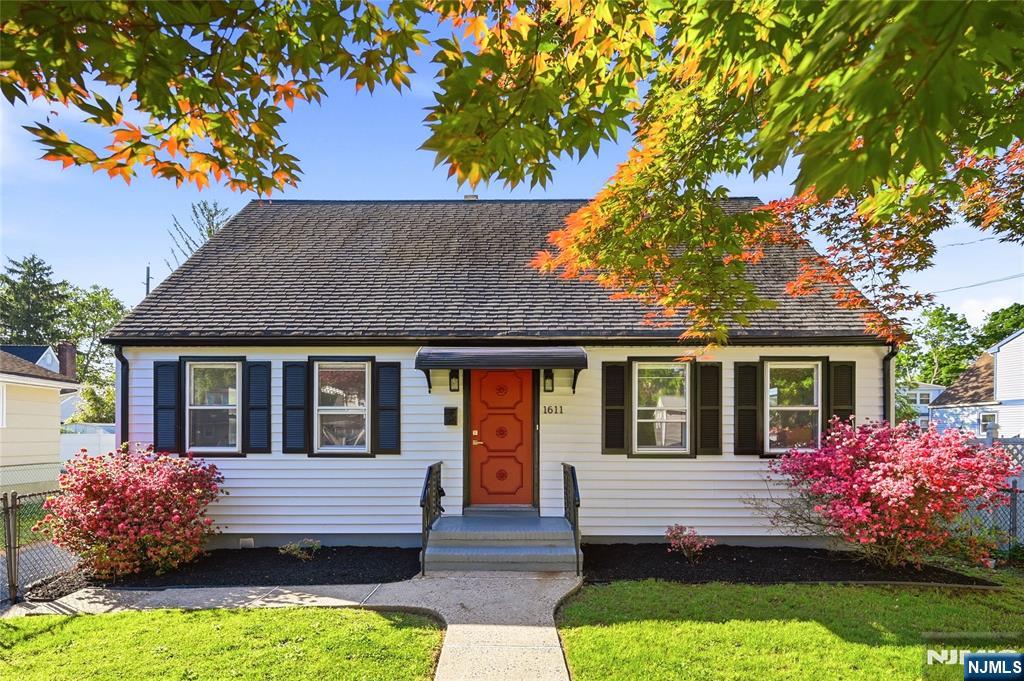 Welcome home to this deceptively spacious Cape Cod-style residence offering the perfect blend of charm, functionality, and modern updates! Much larger than it appears, this move-in ready home features 5 bedrooms, 2 beautifully updated baths, and a partially finished basement with outdoor access. The first floor offers a generously sized living room, formal dining room, and a spacious eat-in kitchen with direct access to the backyard, perfect for everyday living and entertaining. The updated kitchen features freshly painted cabinetry, stainless steel appliances, and quartz countertops. A convenient first-floor bedroom and updated full bath with a neutral designer palette, tub, and built-in niche complete the main level. Upstairs you'll find four additional bedrooms, including one ideal for a home office, along with a newly renovated bath featuring decorative tilework and a sleek shower niche. Additional highlights include hardwood floors, new Andersen windows, LED recessed lighting, and plenty of storage space. Step outside and enjoy summer BBQs and outdoor entertaining on the deck and patio overlooking the backyard. Conveniently located near parks, shopping, restaurants, major highways, and public transportation with access to NYC, this home offers exceptional value and versatility in a convenient location.