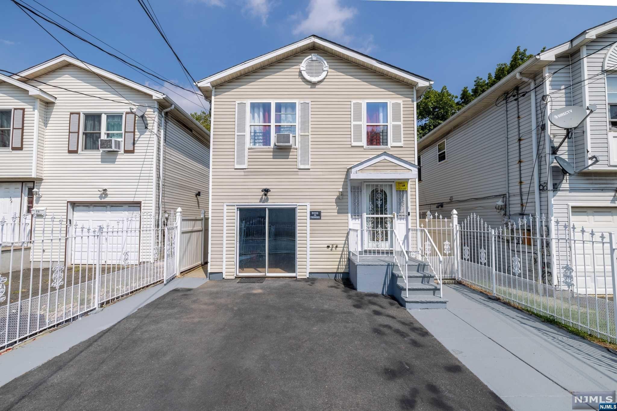 Spacious single family located in Newark's South Bergen St RDV (Redevelopment) Zone with opportunity for mixed-use residential. Upstairs is the main floor with 3 beds/1 bath and open living area. Ground level features separate entrance with additional rooms for entertaining and full bath. Attached garage with access to main house and ground level makes it easy for bringing in groceries. Located with easy access to schools, hospitals (Beth Israel Med Ctr.), stores, public transportation and major highways (78, 22, GSP). Minutes away to Newark Airport and Weequahic Park and Golf Course. Great for investment or to live in with its convenient location.